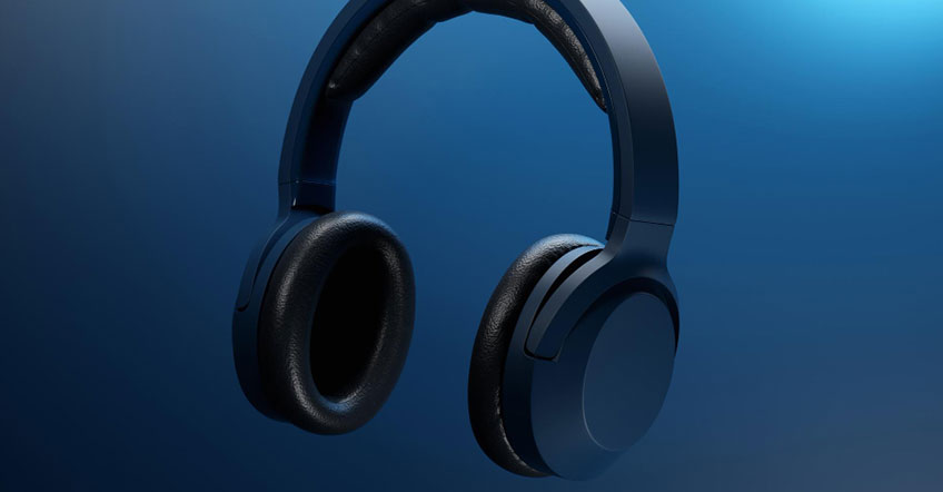 Customer support representative talking through wireless headset in shared workspace