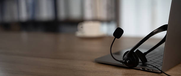Side-by-side comparison showing VoIP phone and older landline handset on table